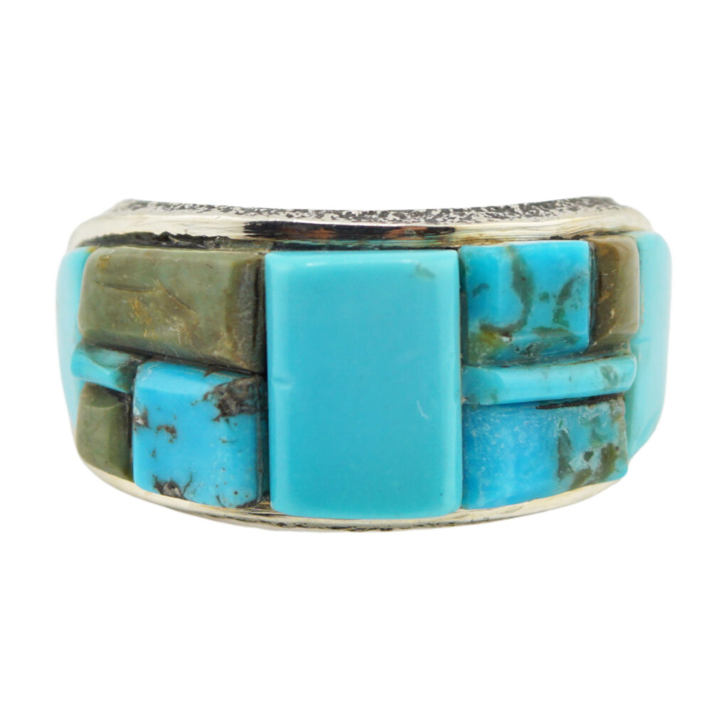 A silver ring featuring rectangular and square turquoise stones in varying shades of blue and green, set in a mosaic pattern.