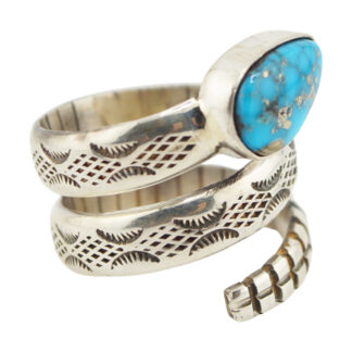 A silver ring designed to resemble a coiled snake, featuring engraved patterns and a large oval turquoise stone set in the head of the snake.