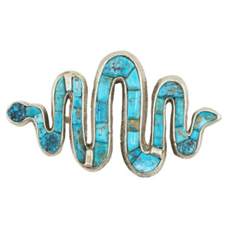 A wavy, zigzag-shaped pin made of silver and inlaid with turquoise stones, forming an abstract, snake-like design.