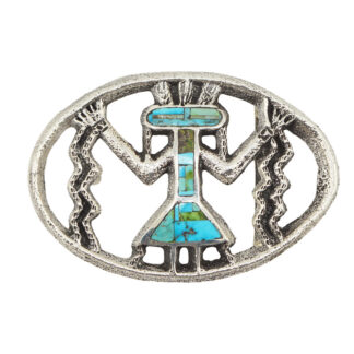 Oval-shaped silver belt buckle featuring a stylized figure with raised arms, turquoise and green stone inlays, and zigzag lines on each side, resembling Southwestern or Native American design.