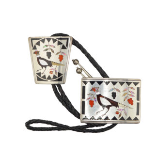 The Vintage Ranger Buckle Set by Stanford & Diane Cooche (Zuni) is a decorative bolo tie with a black braided cord, silver tips, and metal clasps inlaid with birds, colorful flowers, and geometric patterns.